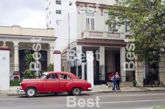 American classic cars driving on the street in Havana