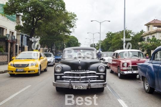 American classic cars driving on the street in Havana