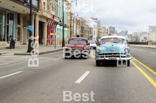 American classic cars driving on the street in Havana