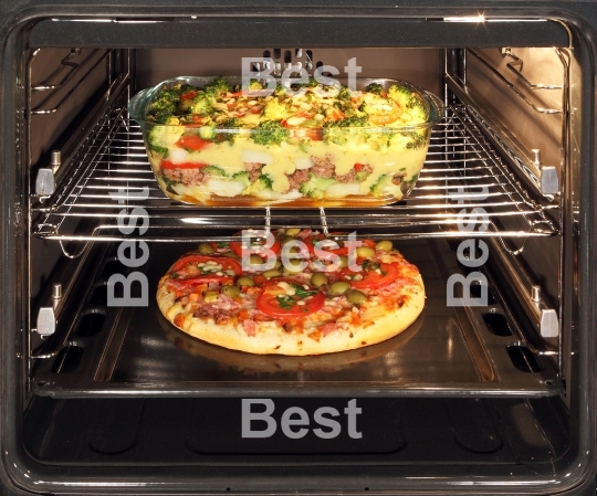 Baking pizza and casserole dish in oven