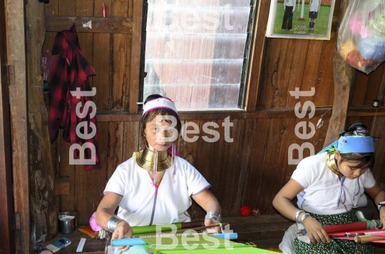 Burmese women weaving silk clothe
