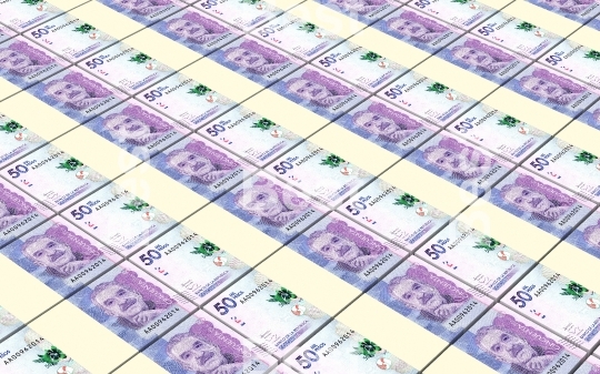 Colombian pesos bills stacked background