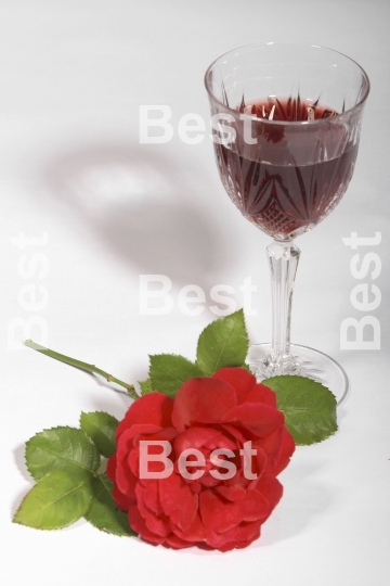 Crystal wine glass with red rose