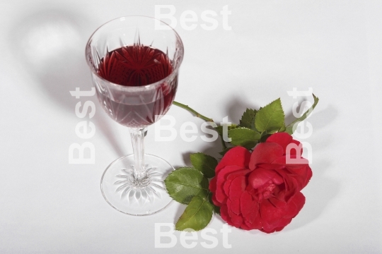 Crystal wine glass with red rose