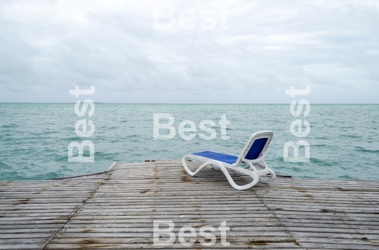 Empty beach chairs on the dock