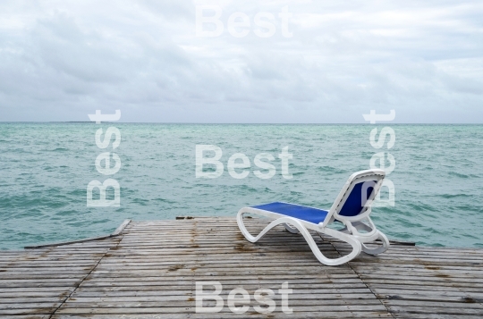 Empty beach chairs on the dock