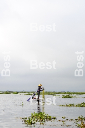 Fisherman catches fish on Inle Lake, Burma (Myanmar).