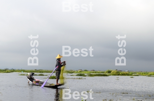 Fisherman catches fish on Inle Lake, Burma (Myanmar).