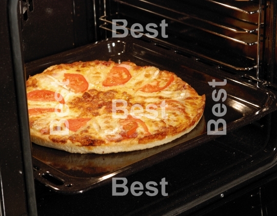 Fresh pizza in oven