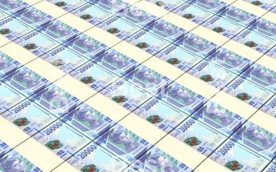 Guinean francs bills stacked background