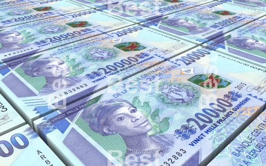 Guinean francs bills stacked background