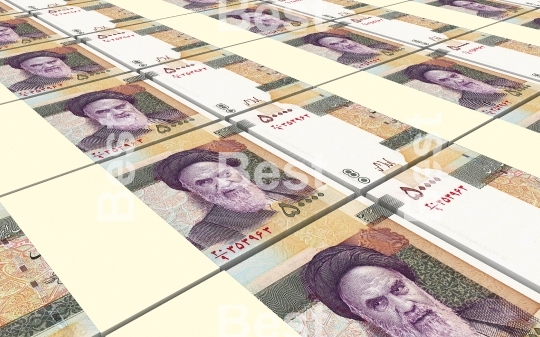 Iranian rials bills stacked background