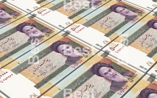 Iranian rials bills stacked background