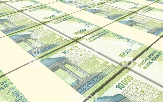 Iranian rials bills stacked background