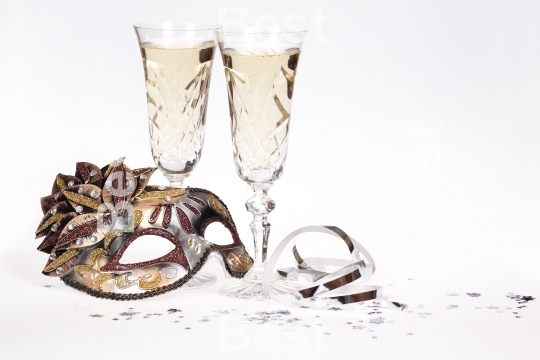 Masquerade mask and champagne
