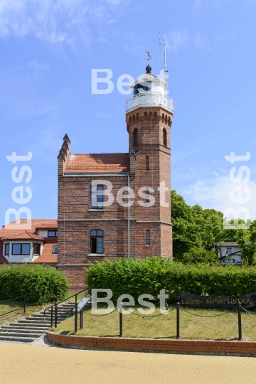 Old lighthouse in the harbor in Ustka, Poland. 