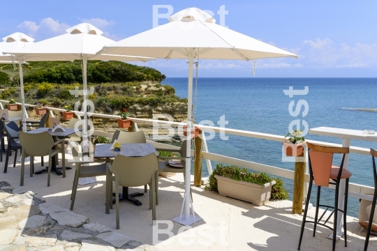 Restaurant with umbrellas with magnificent view of the cliffs near Sidari