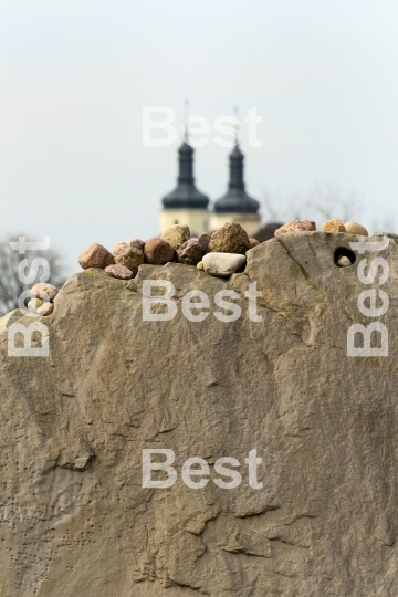 Stones on a sandstone wall.