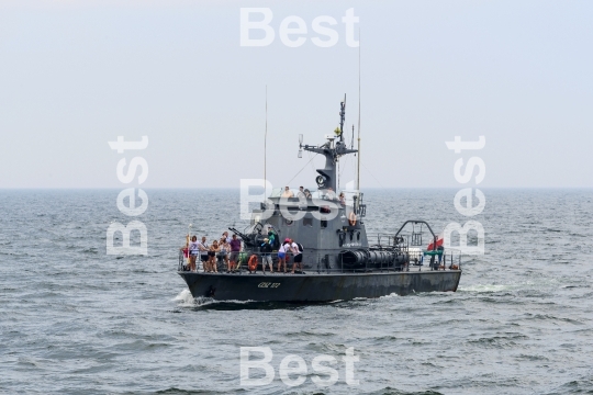 Tourists cruise military ship