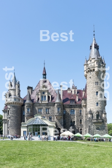 Tourists enjoying the beautiful weather visit the palace in Moszna.