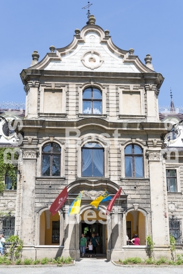 Tourists enjoying the beautiful weather visit the palace in Moszna.