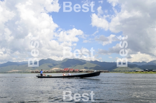 Tourists take part in a boat trip on Inle Lake