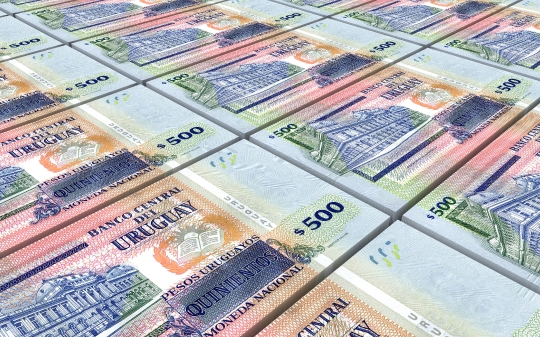 Uruguay peso bills stacks background