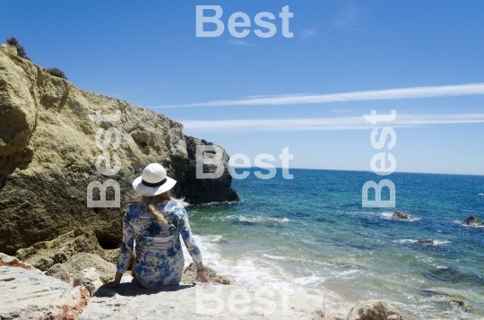 Woman sitting at the beach