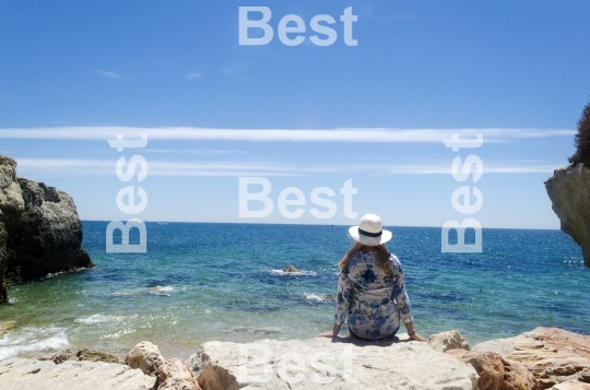 Woman sitting at the beach