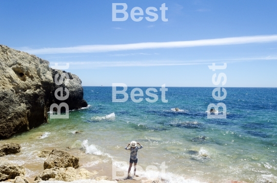 Woman standing on the beach