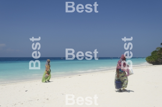 Women with colorful clothes on the beach in Nungwi