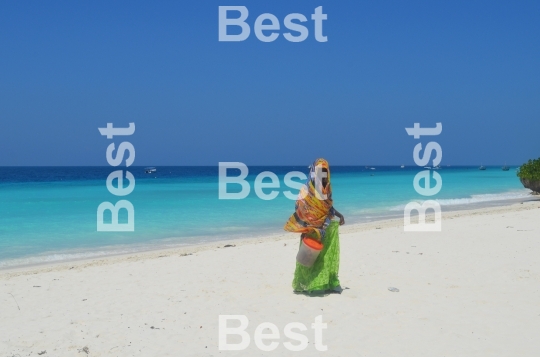 Women with colorful clothes on the beach in Nungwi