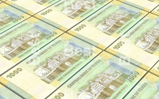 Yemeni rials bills stacks background