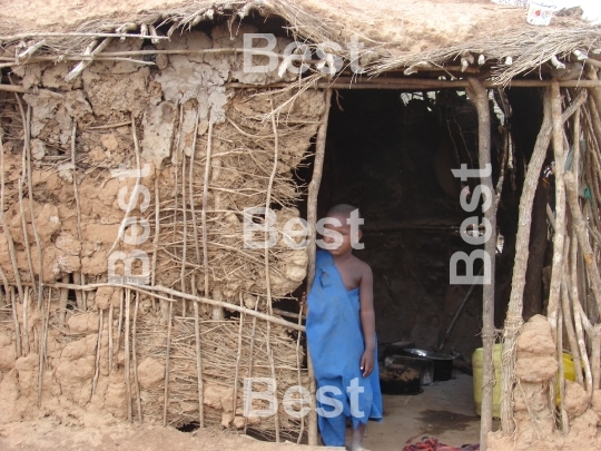 Child in a traditional Masai village at the Nairobi-Mombasa road next to Tsavo National Park.