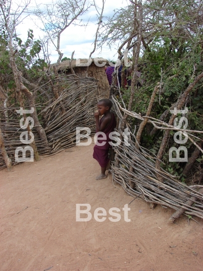 Child in a traditional Masai village at the Nairobi-Mombasa road next to Tsavo National Park.