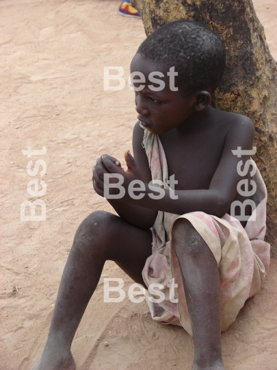 Young boy in the village. Masai village at the Nairobi-Mombasa road next to Tsavo National Park Kenya 